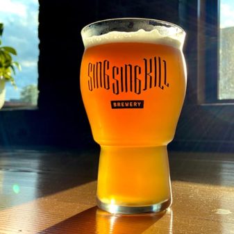 Craft Beer Glass on Table in Sun